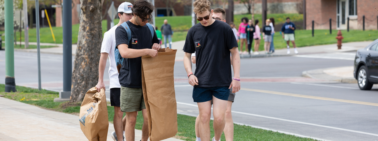 Students help with neighborhood cleanup.